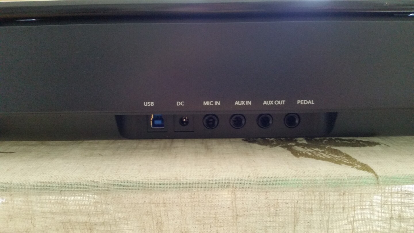 The back of the One Smart Light piano with multiple plug-ins