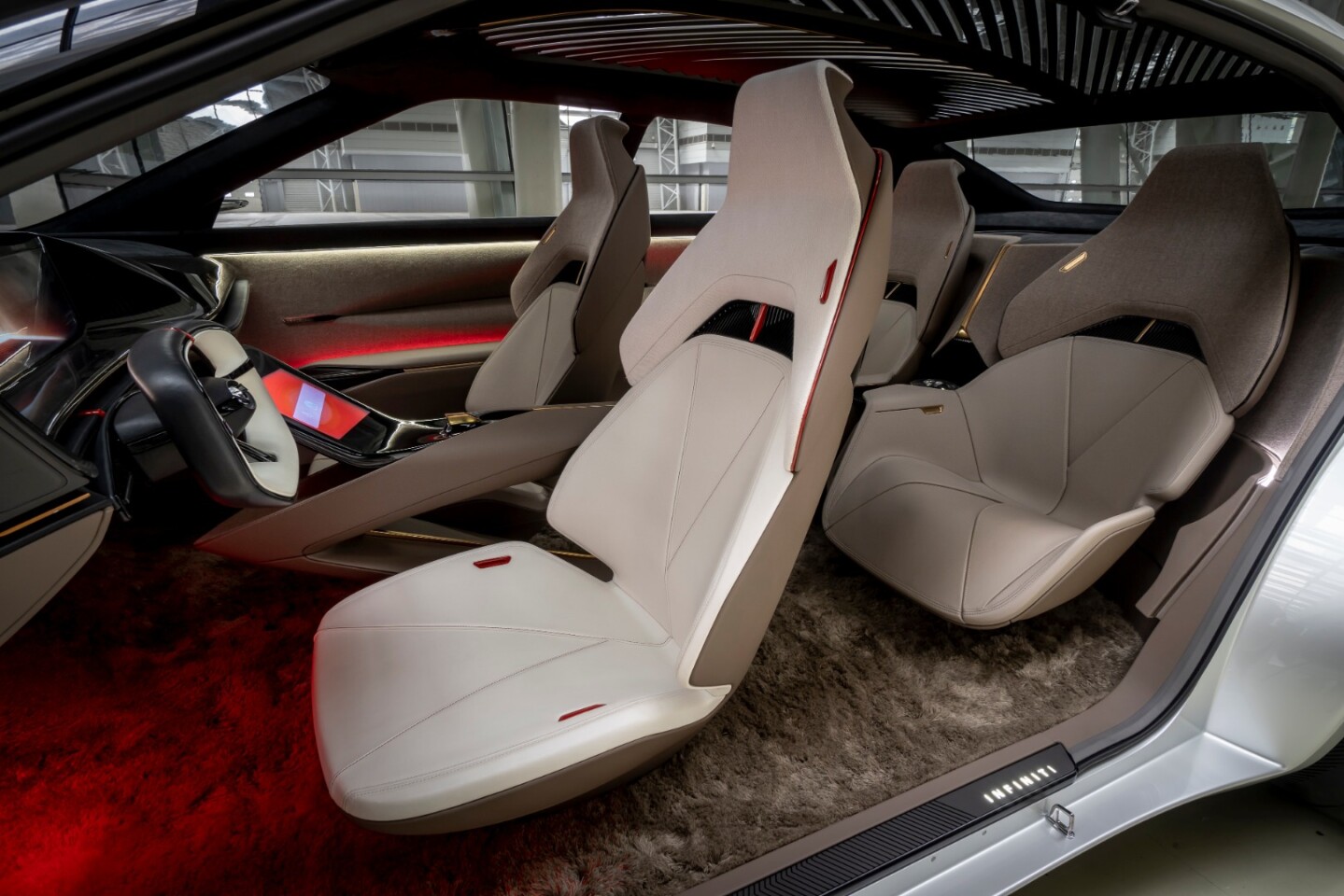 Seat rails and supports are deeply inset to give the chairs a floating appearance in the Infiniti Qs Inspiration