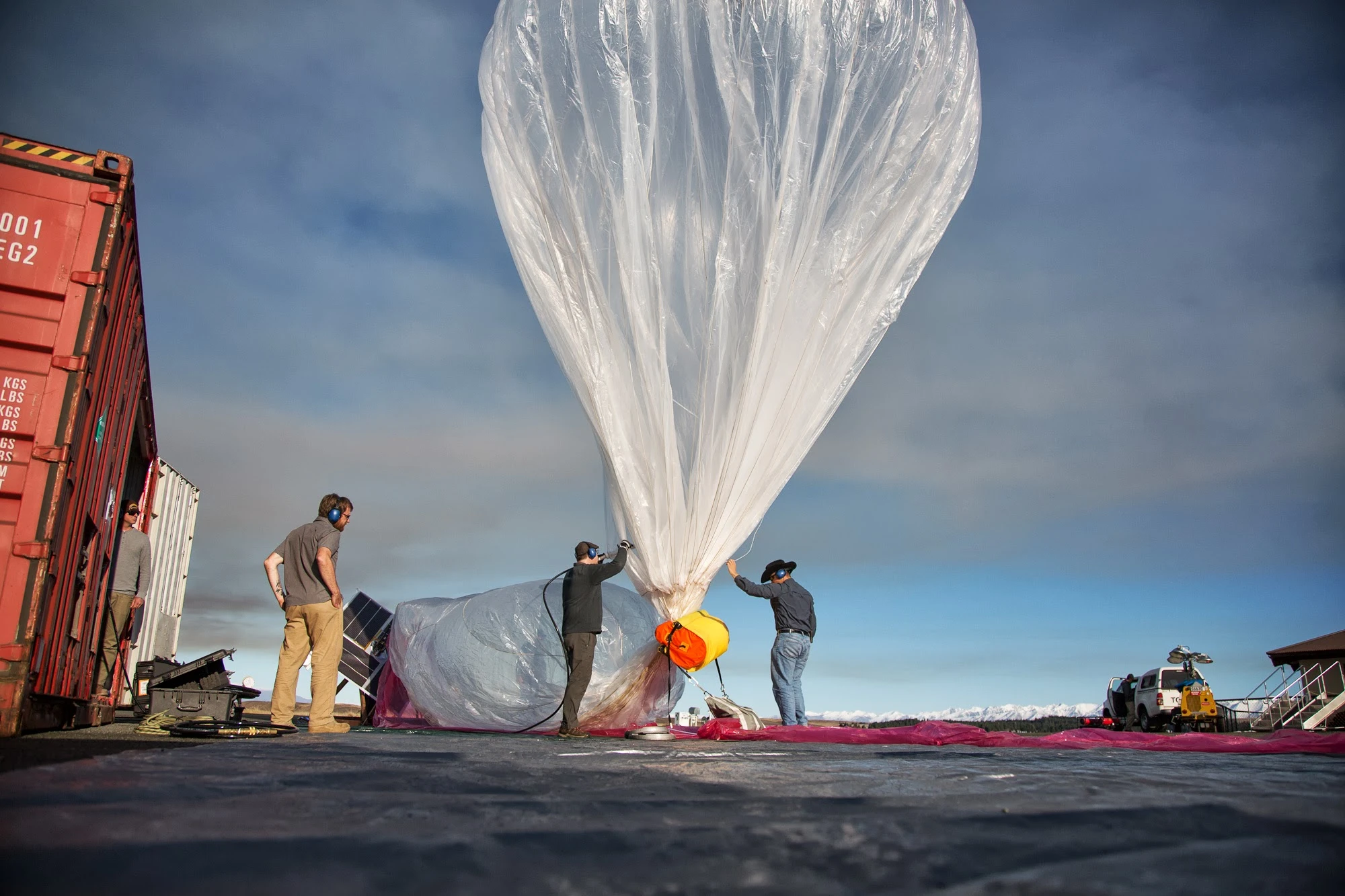 The balloon carries a box of electronics beneath it, which contains radio antennas to communicate with the ground and other balloons, GPS, flight sensors, instruments to monitor weather conditions, and the necessary circuit boards for controlling the whole system