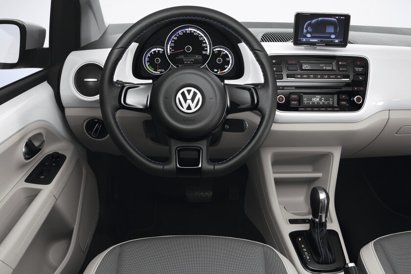 The interior includes chrome and leather accents
