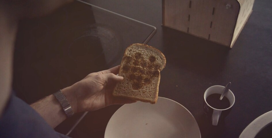 A piece of toast with a 6 pixels by 6 pixels images of a heart printed on to it