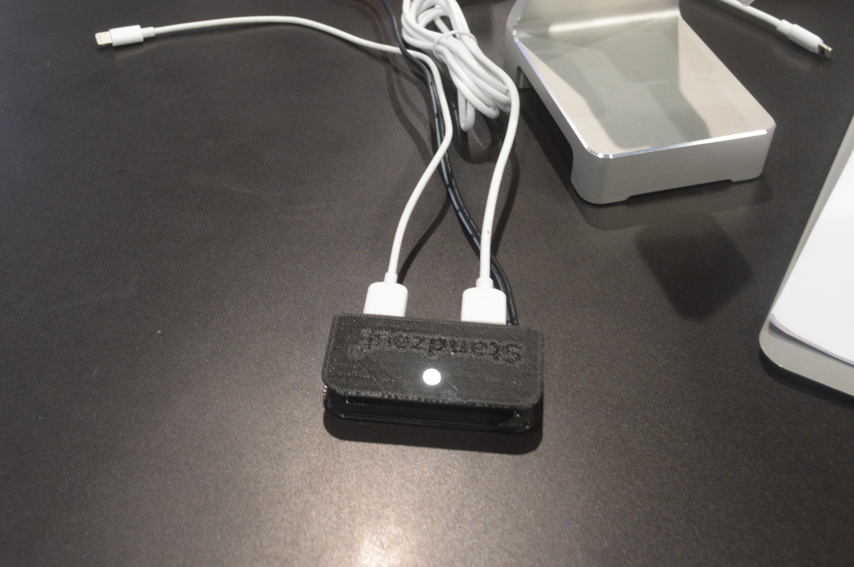 The USB charging hub, which fits in the space visible in the base of the Bandstand (Photo: C.C. Weiss/Gizmag)