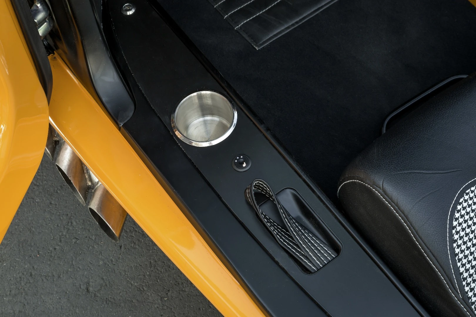 The Laguna is an automatic, so that cupholder might actually be usable on the move