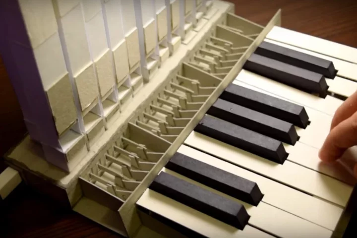 The "wind" needed for the paper pipe organ is supplied by a deflating balloon attached to the housing