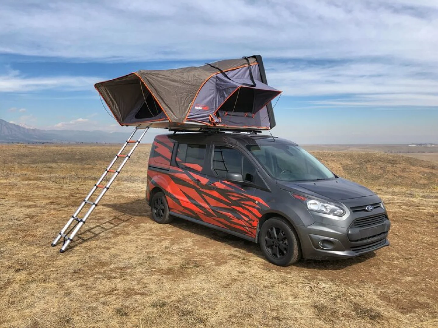 Fiery $35K+ Ford mini-campervan seats and sleeps a family of five