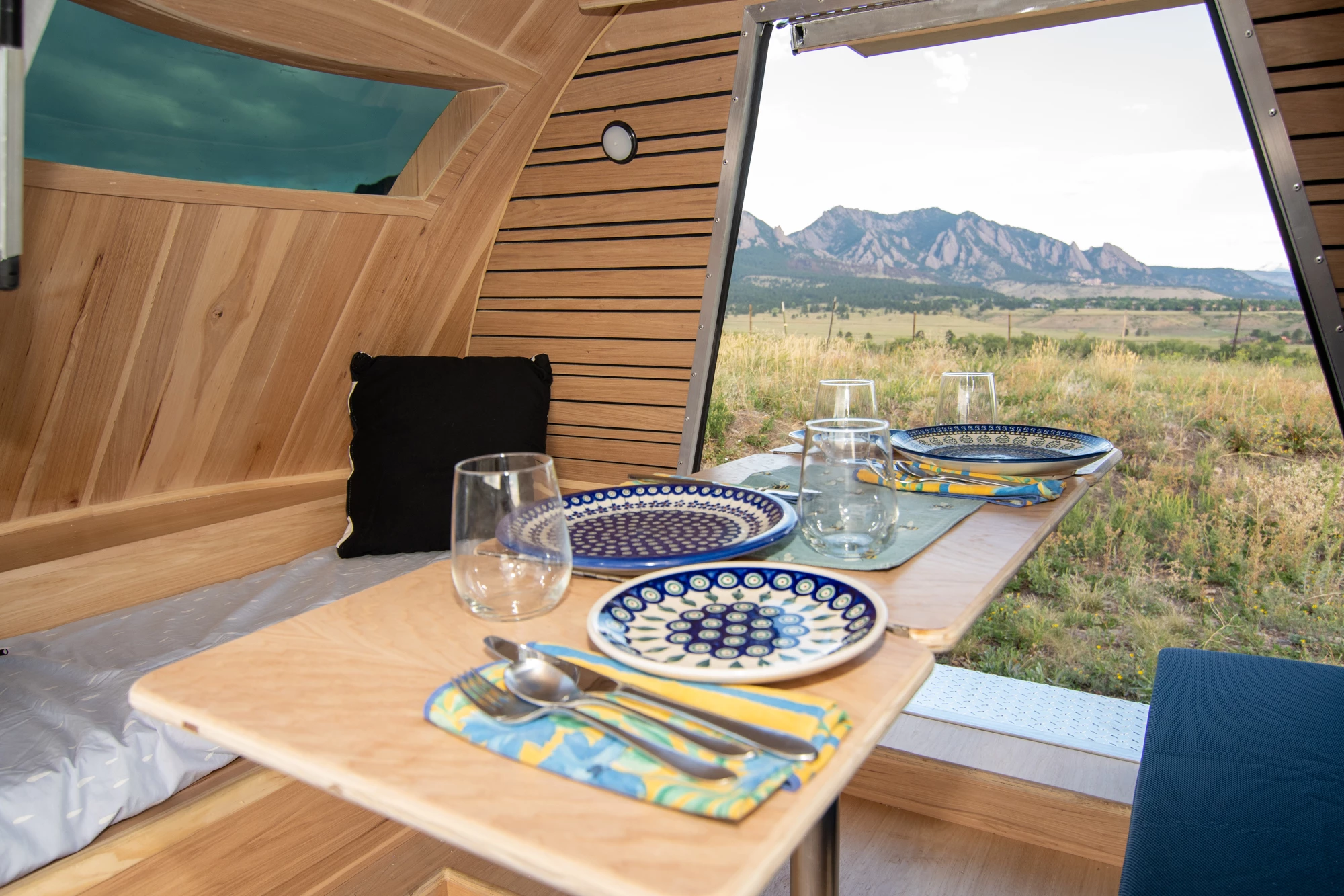 Dual gullwing doors create a scenic, airy space