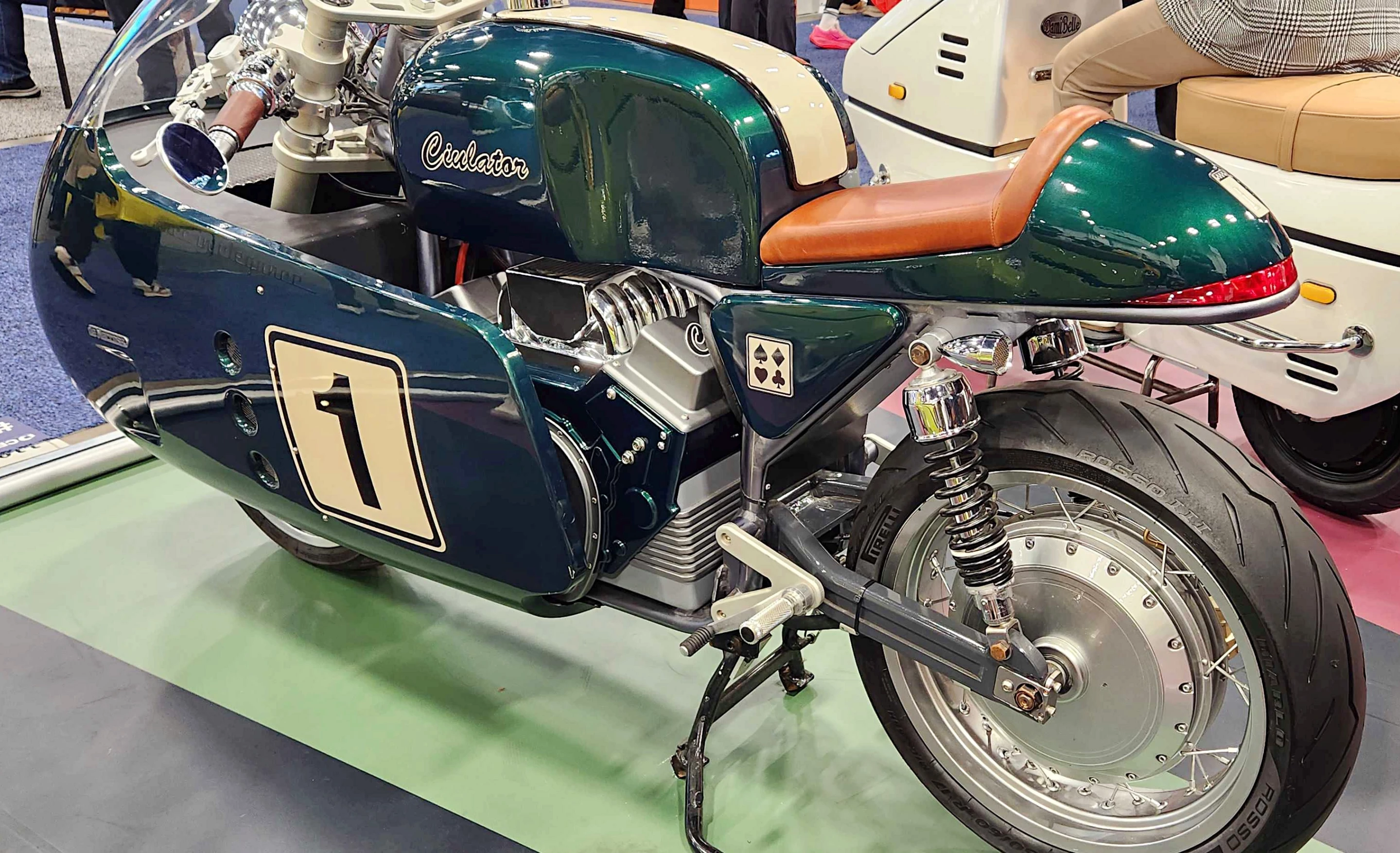 The battery pack on the motorcycle is sculpted to resemble a combustion engine