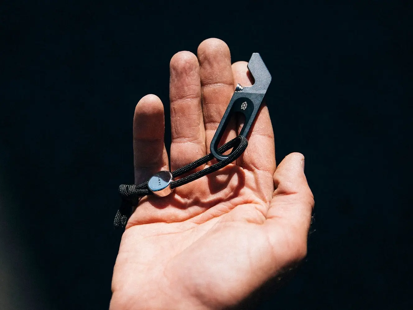 The Halifax multitool features a flathead and Philips head combination screwdriver, a scraper and pry bar running up its front edge with a bottle opener built in underneath