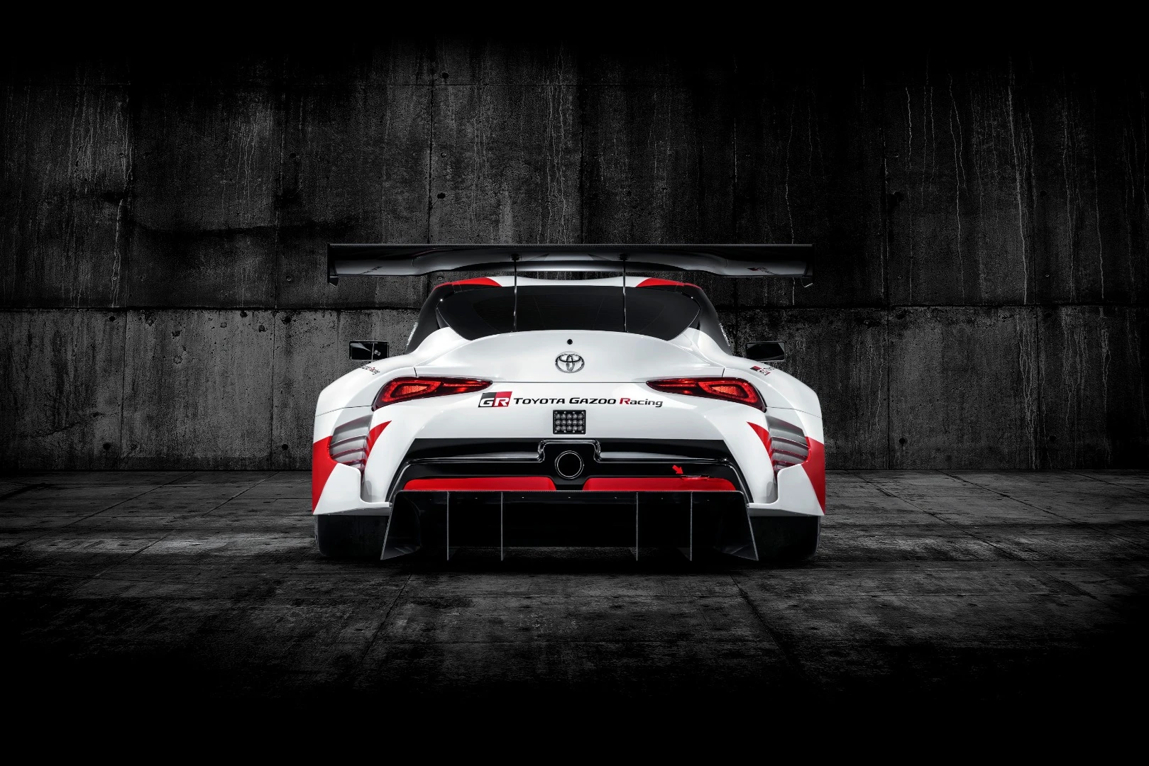 The rear of the Toyota GR Supra Racing Concept has a strong accent on aerodynamic flow and the large fin for rear-wheel downforce
