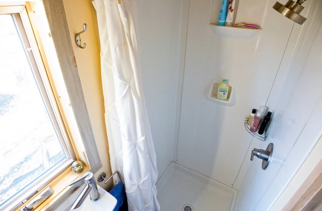 The bathroom's small but functional shower cubicle