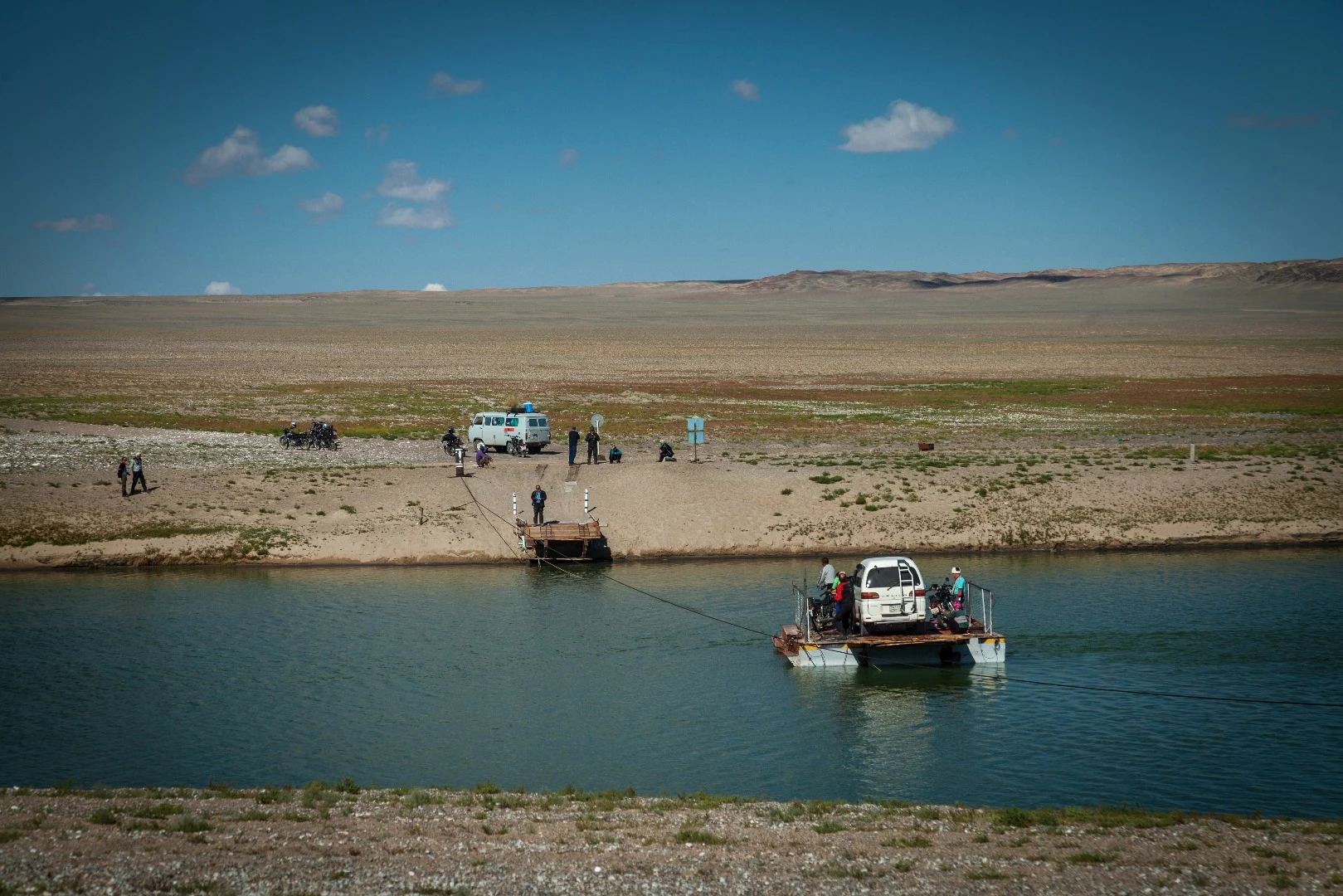 Crossing lake Hyargas nuur by hand-pulled ferry