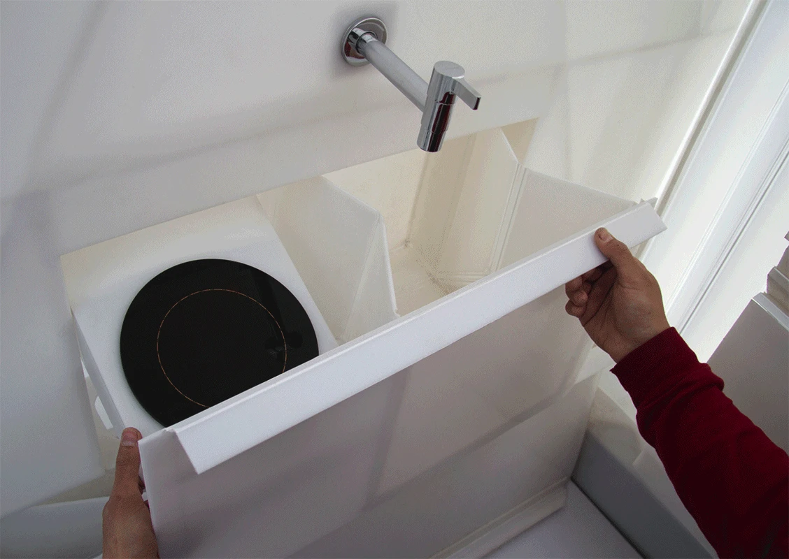 Modern amenities like a bath, bed, and water tank are included