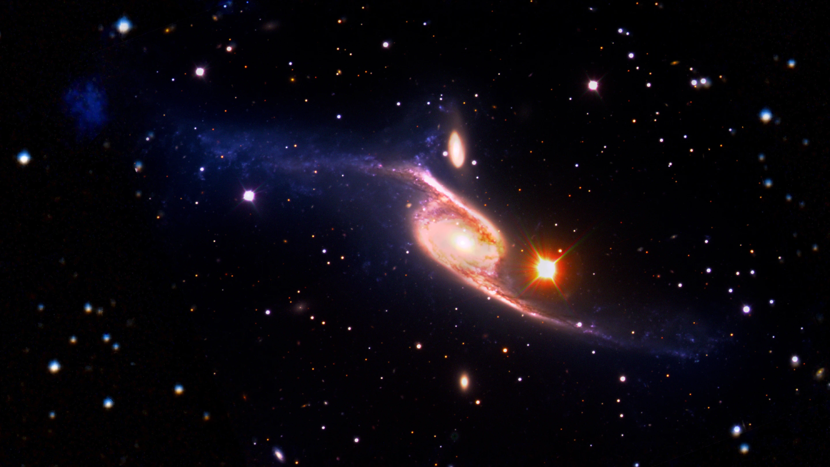 Spiral galaxy NGC 6872 is some five times the size of the Milky Way