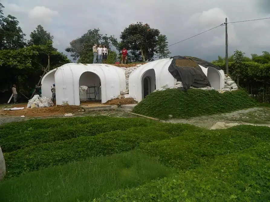 When soil is added to a prefabricated Green Magic Home, its weight reportedly actually helps press the sections together, adding strength instead of creating structural stress