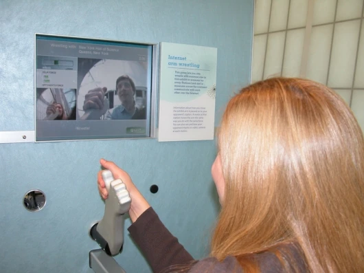 Wendy J. Brez tests out the machine at the New York Hall of Science in Queens, NY.