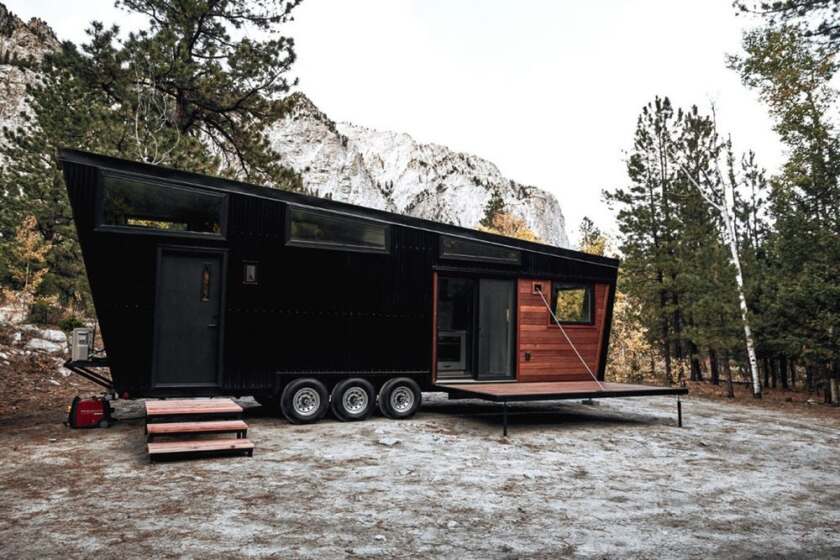 The Draper is finished in black corrugated metal siding with wood accenting