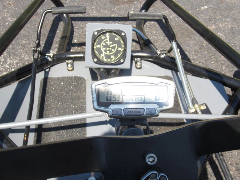 The kart's N1 gas producer tachometer (top) and digital speedometer