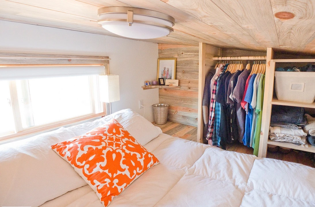 The compact sleeping zone is light-filled and cozy