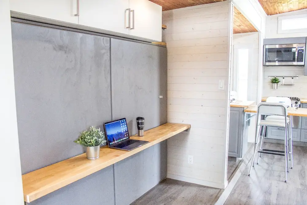 The Aurora's office/bedroom, with bed stowed away