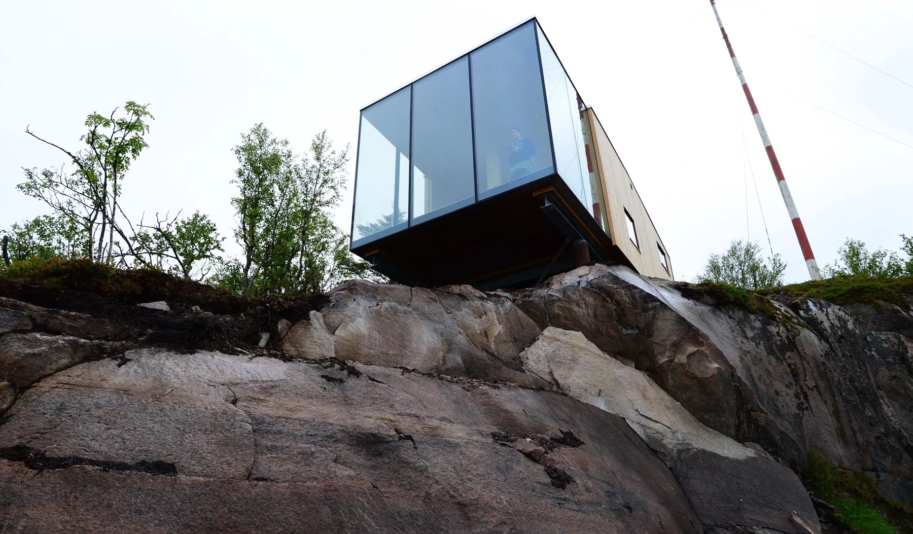 Three of the cabins are situated on a old stone jetty and another one is raised above the others on a natural ledge in the terrain