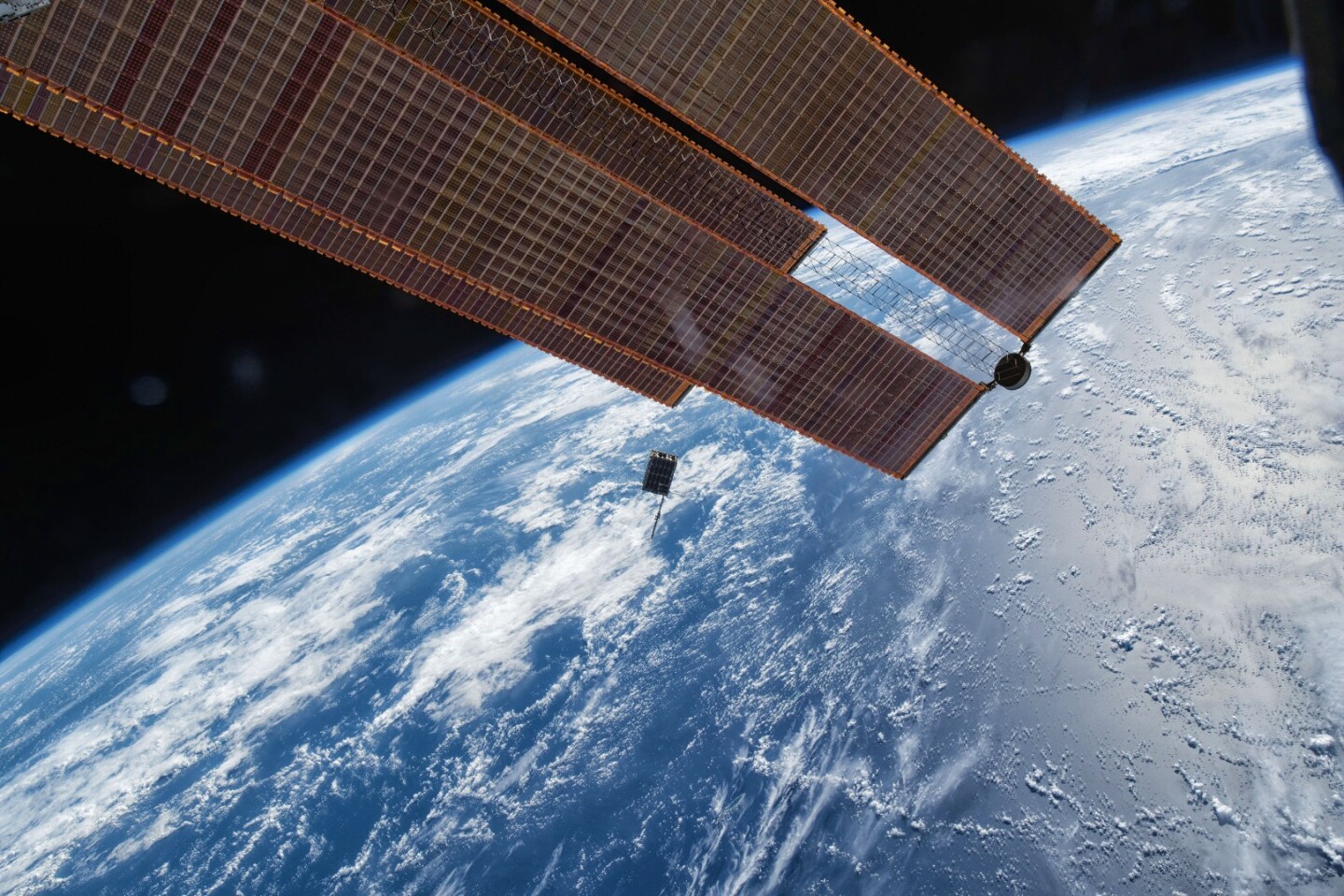 Dellingr passing one of the ISS's solar arrays