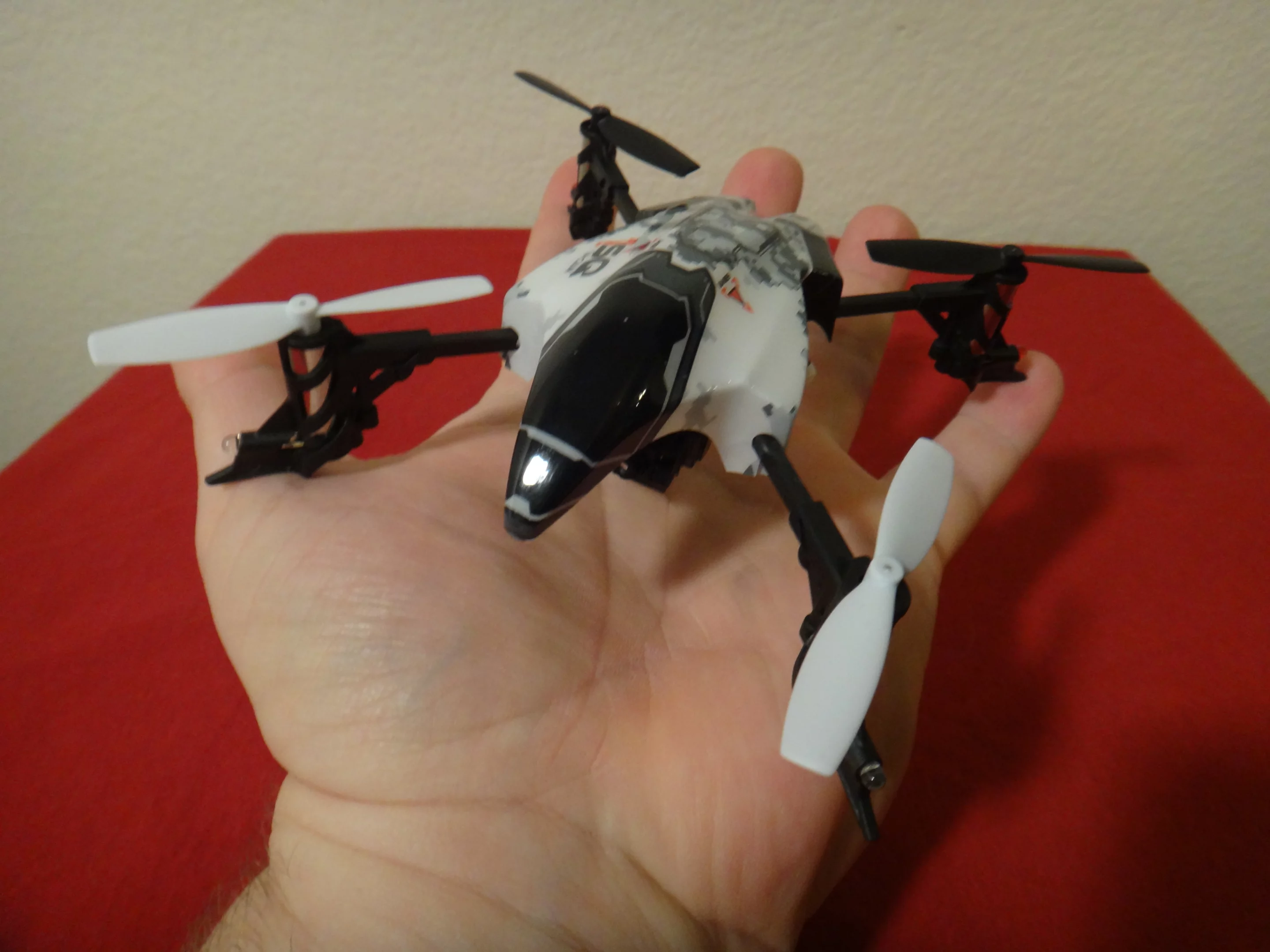 The quadcopter itself fit nicely in the palm of my hand, measuring just 14.5 x 14.3 cm