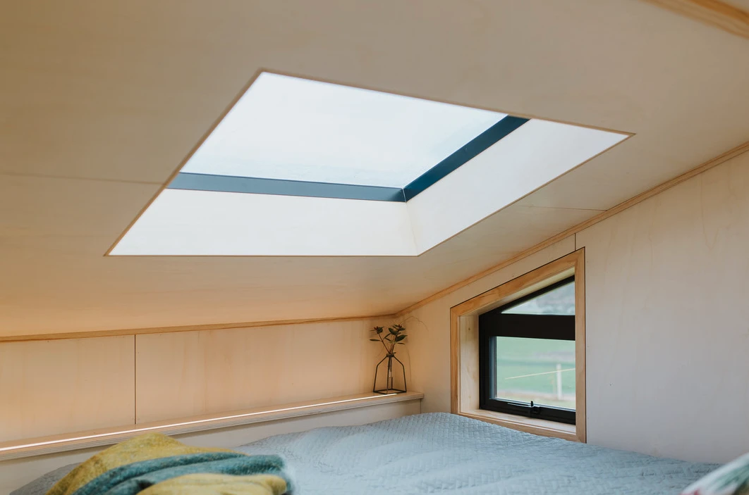 The First Light Tiny House's bedroom is topped by a skylight