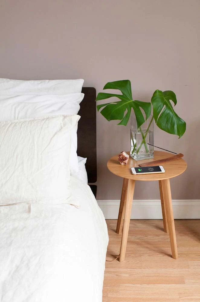 The FurniQi side table combines wireless Qi technology with bamboo wood construction