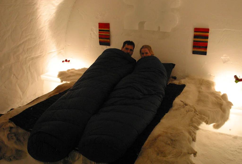 Guests will need to snuggle into a warm down sleeping bag, woolen socks and a hood inside an Ice Igloo (image from Hotel Kakslauttanen)