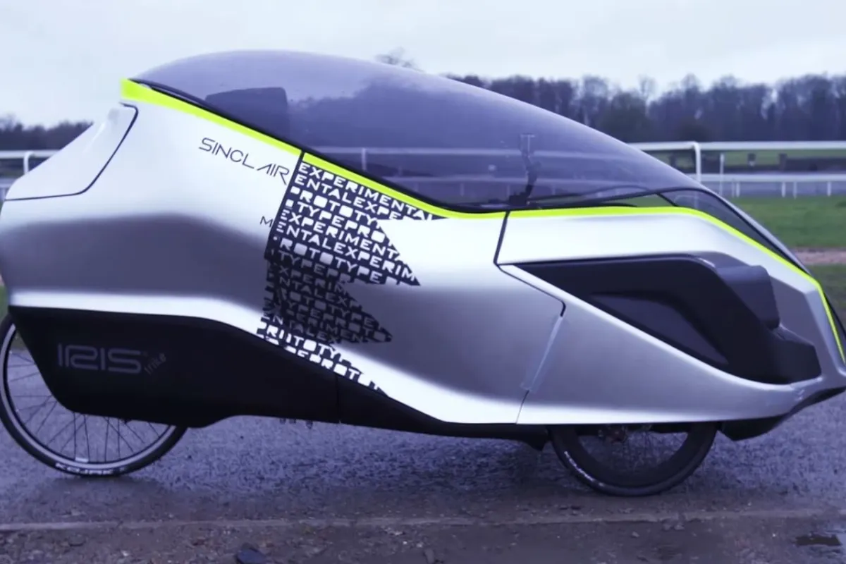 The Iris eTrike is an electric hybrid recumbent tricycle with a plastic canopy