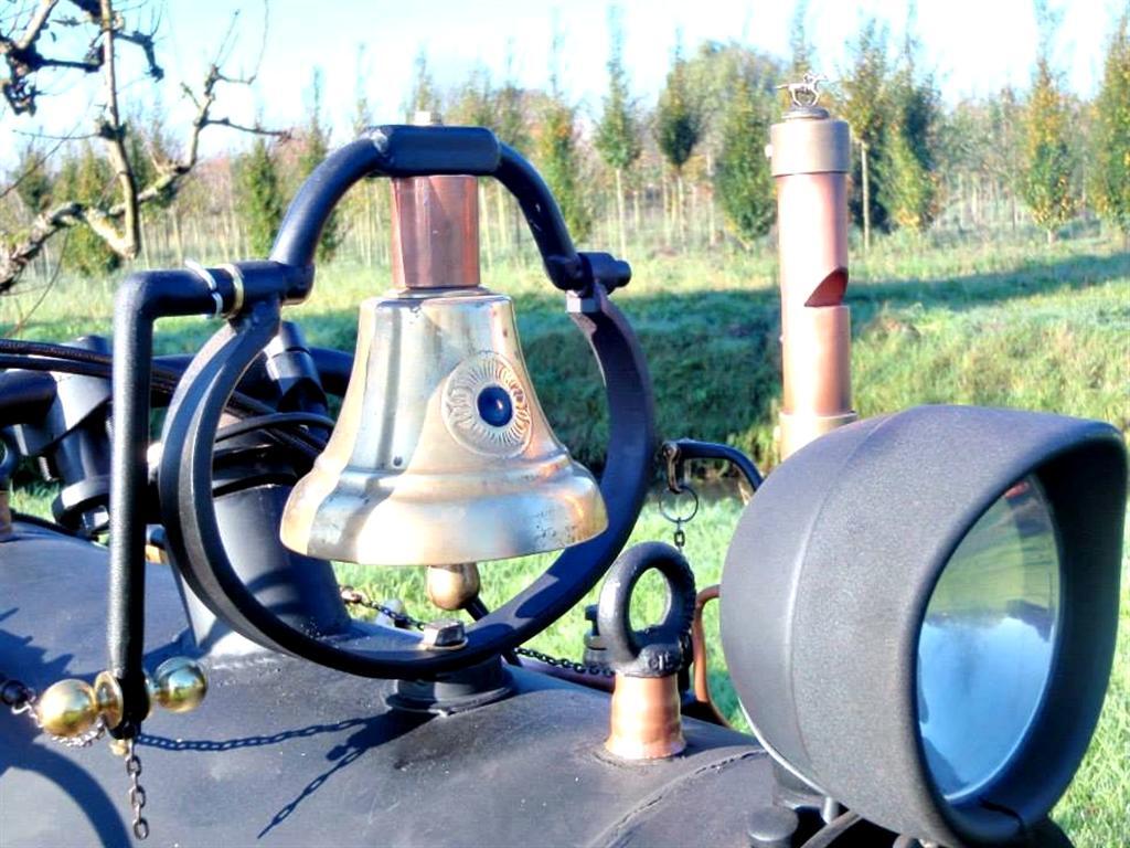 A bell and a steam horn, operated from the handlebars