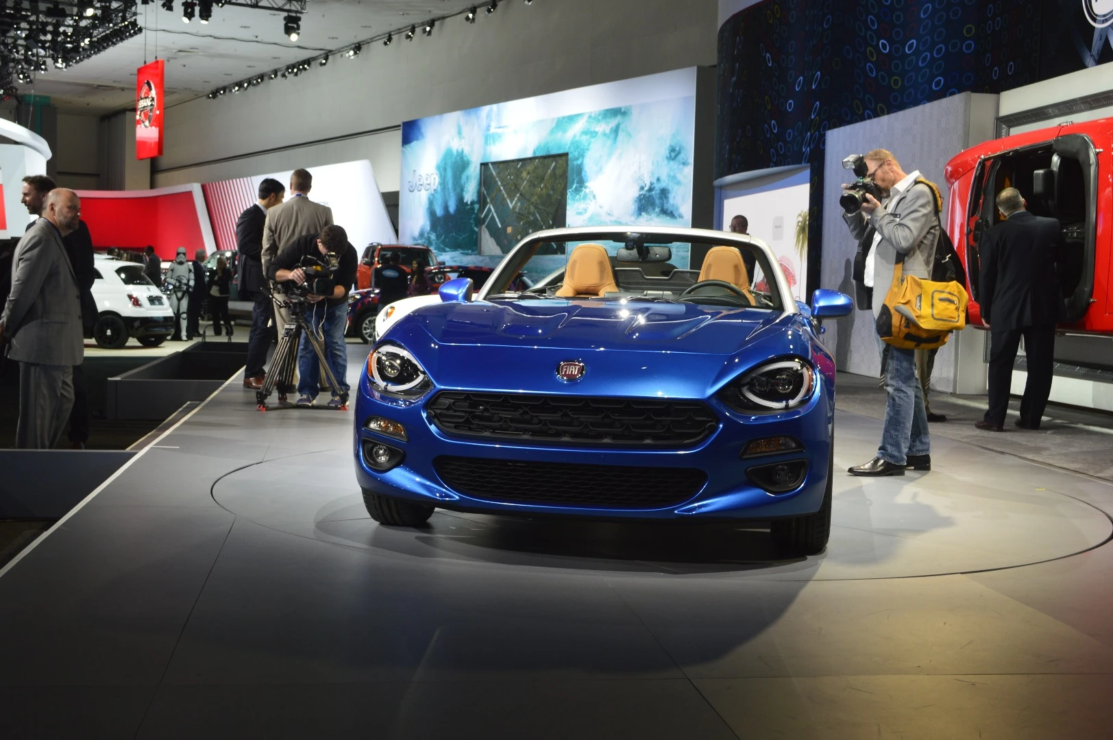 The most telling features are the Fiat bug eyes at the front