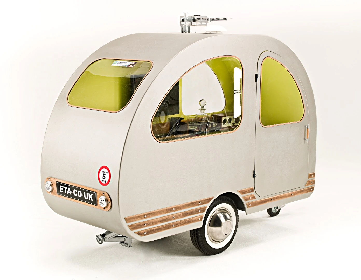 The 289-lb (131-kg) QTvan sleeps one in its narrow chamber