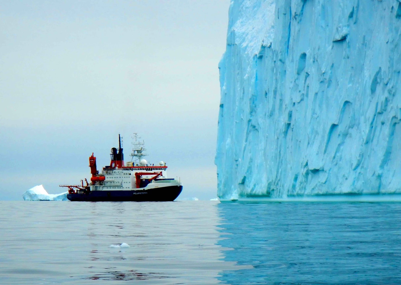 The RV Polarstern alongside a massive glacier, off the coast of West Antarctica