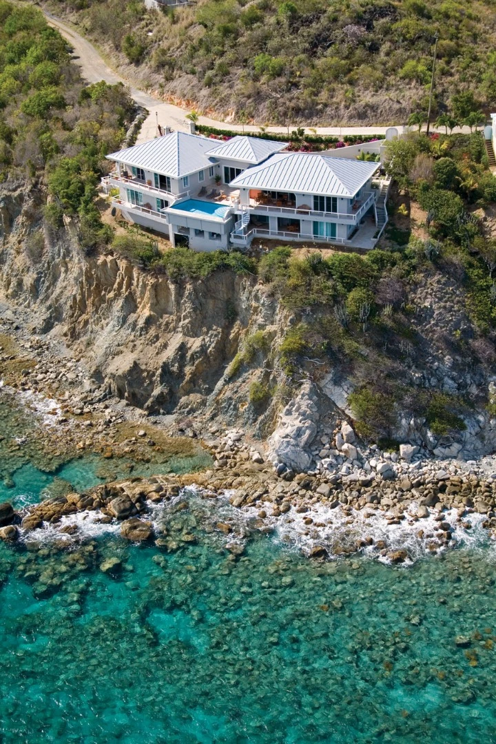 Cabrita Cliff Haus is as precarious as they come. A luxury villa sitting on the cliff off the coast of St Thomas in the US Virgin Islands. The villa is available for short-term holiday rentals
