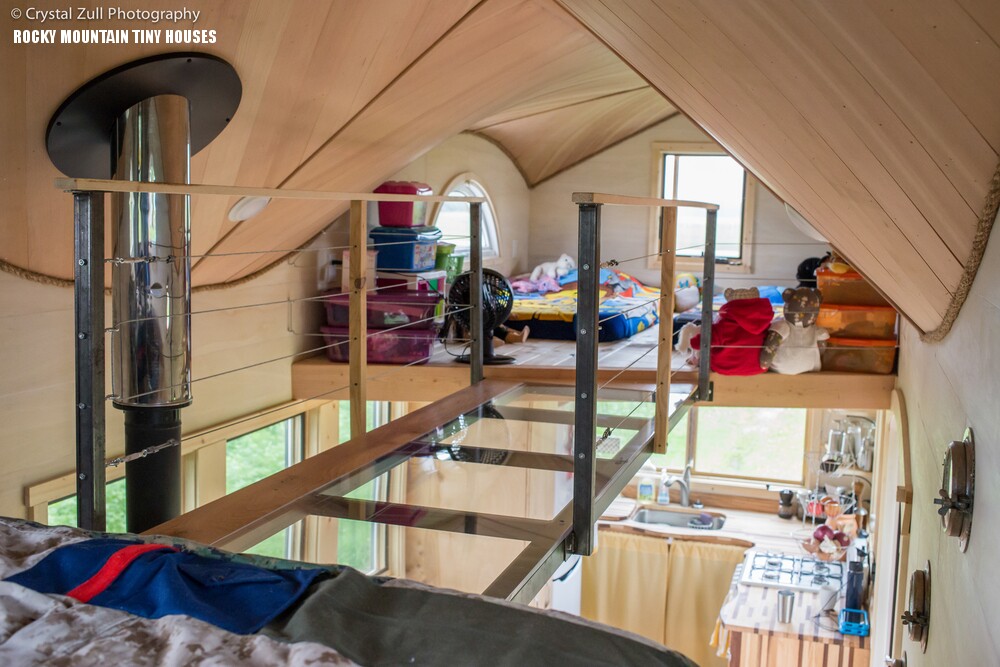 A plexiglass-bottomed walkway joins both loft bedrooms