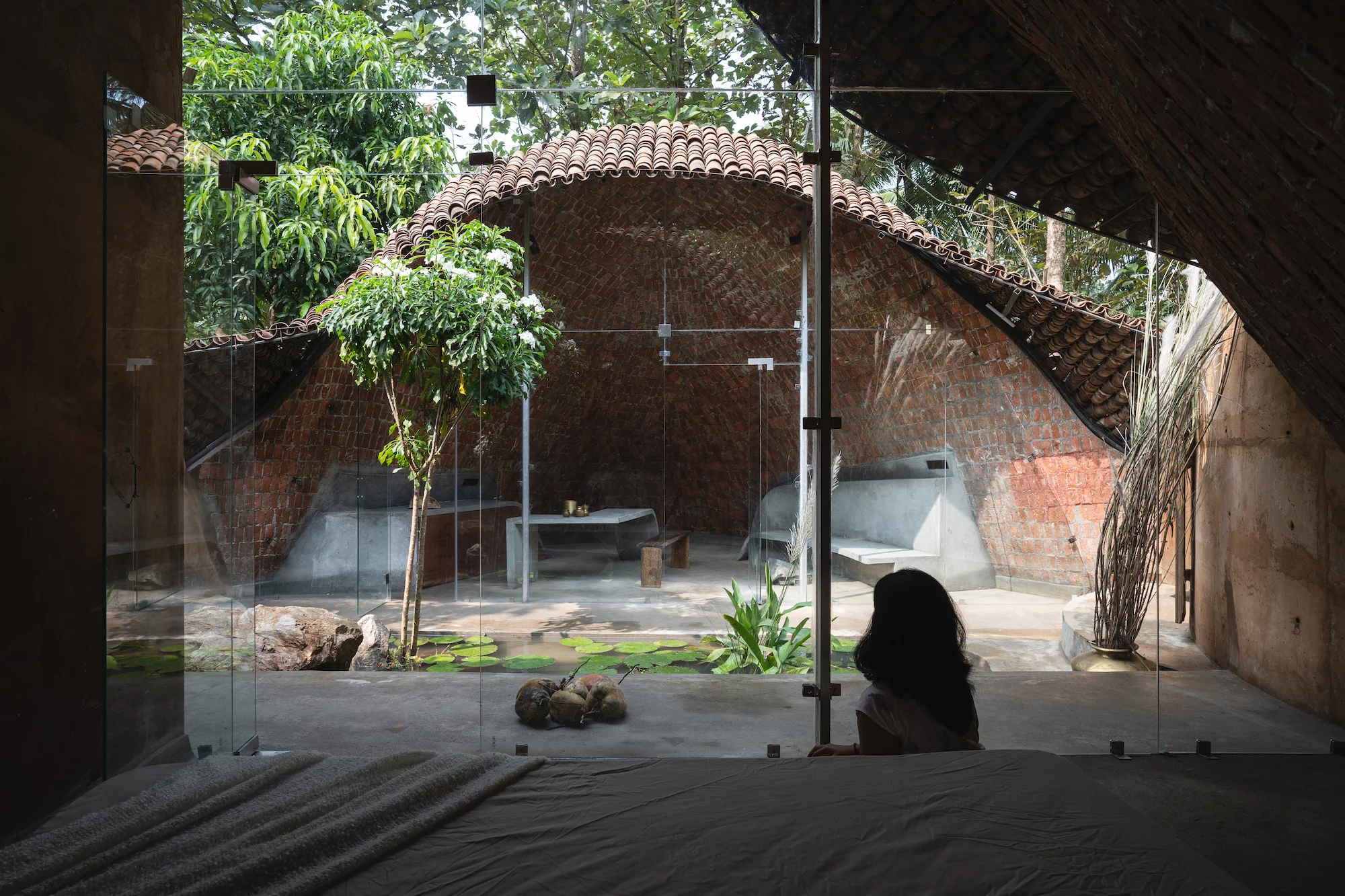 The Wendy House's interior is enclosed by glazing, maximizing natural light throughout