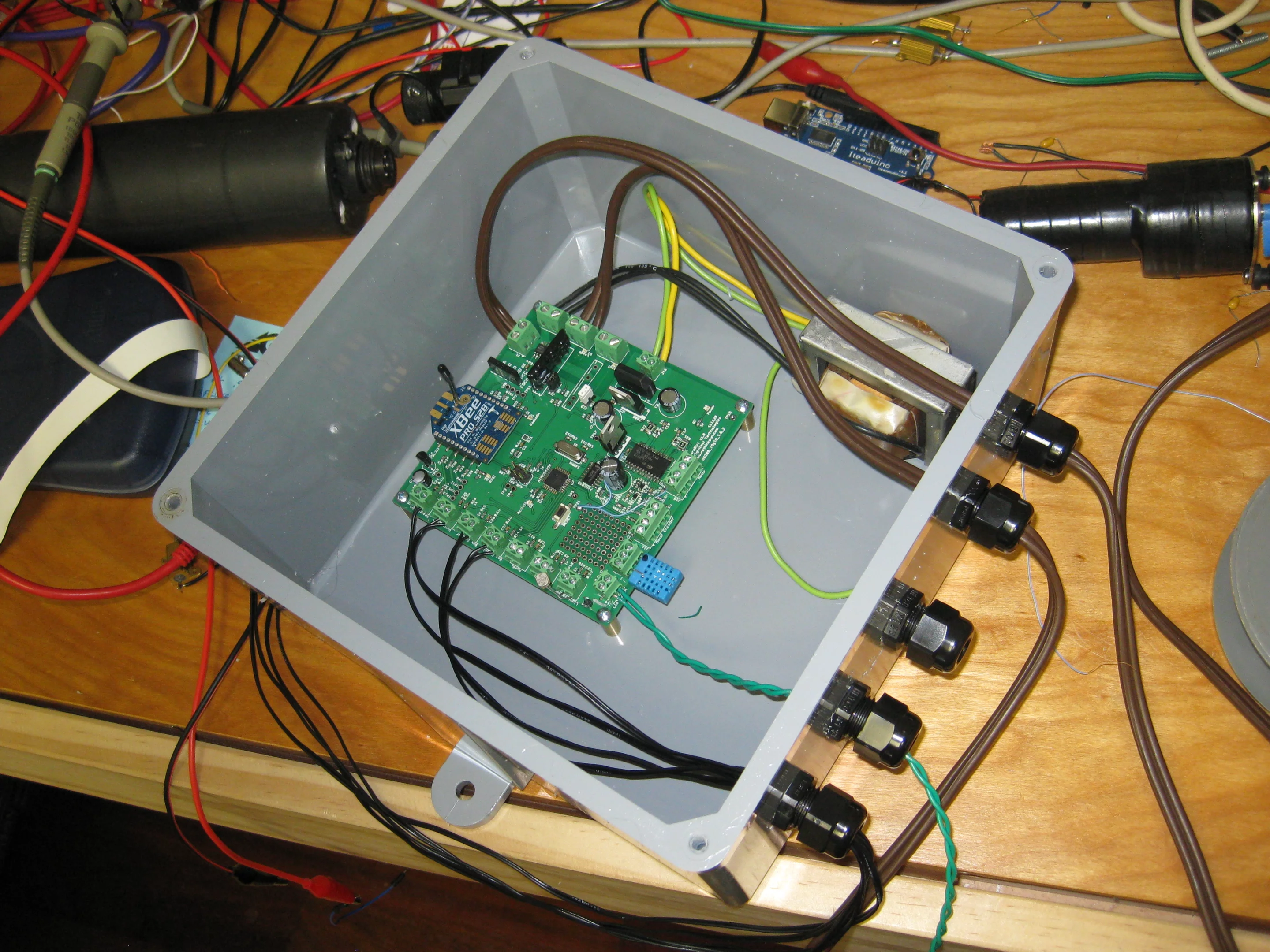 The WarmDirt control board with Atmel ATMEGA328P microcontroller is mounted in a waterproof NEMA-4 outdoor electrical enclosure