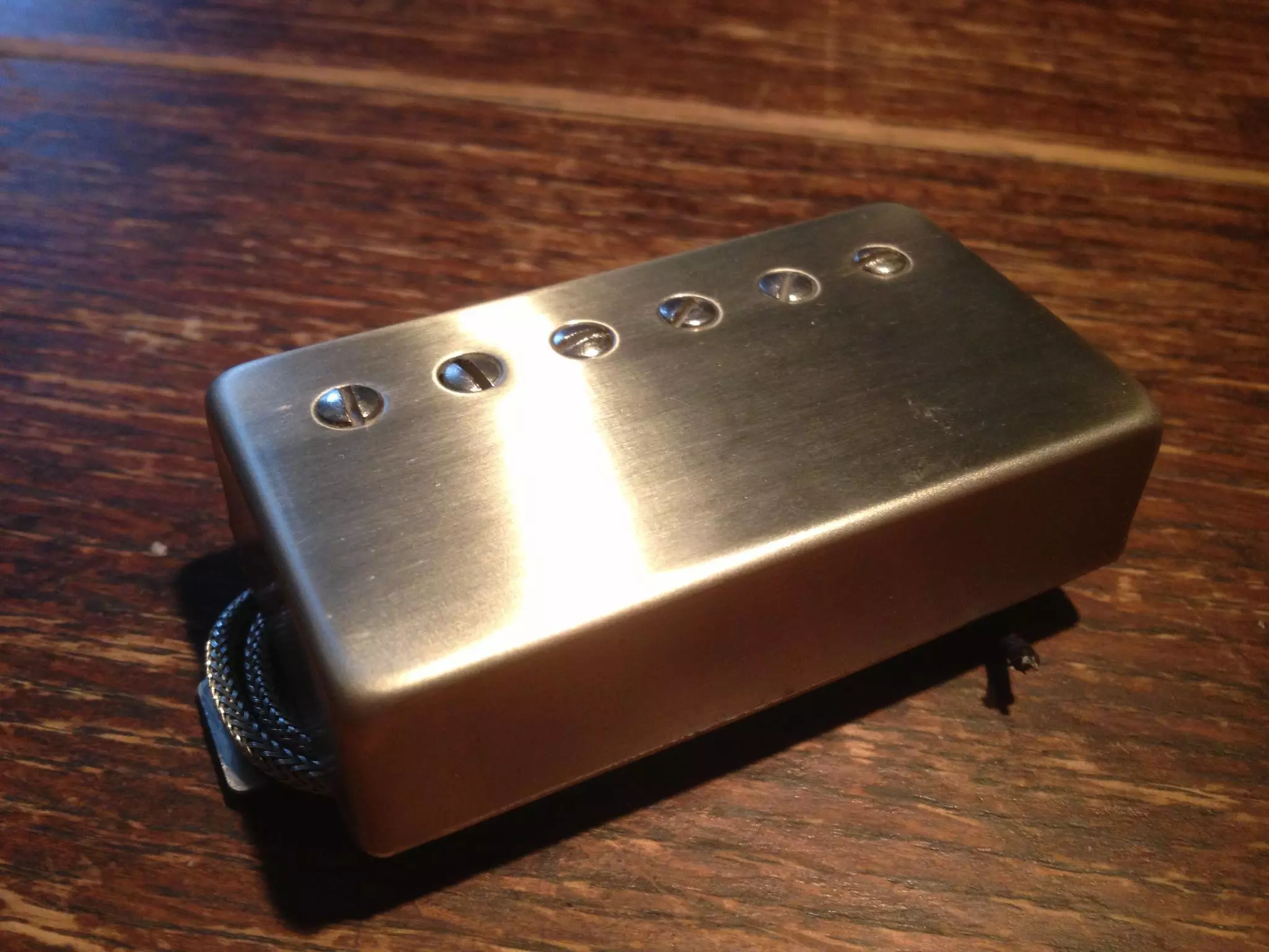 An SP Custom Savage Beast humbucking pickup waiting to be installed into the fiberglass body of The Hot First