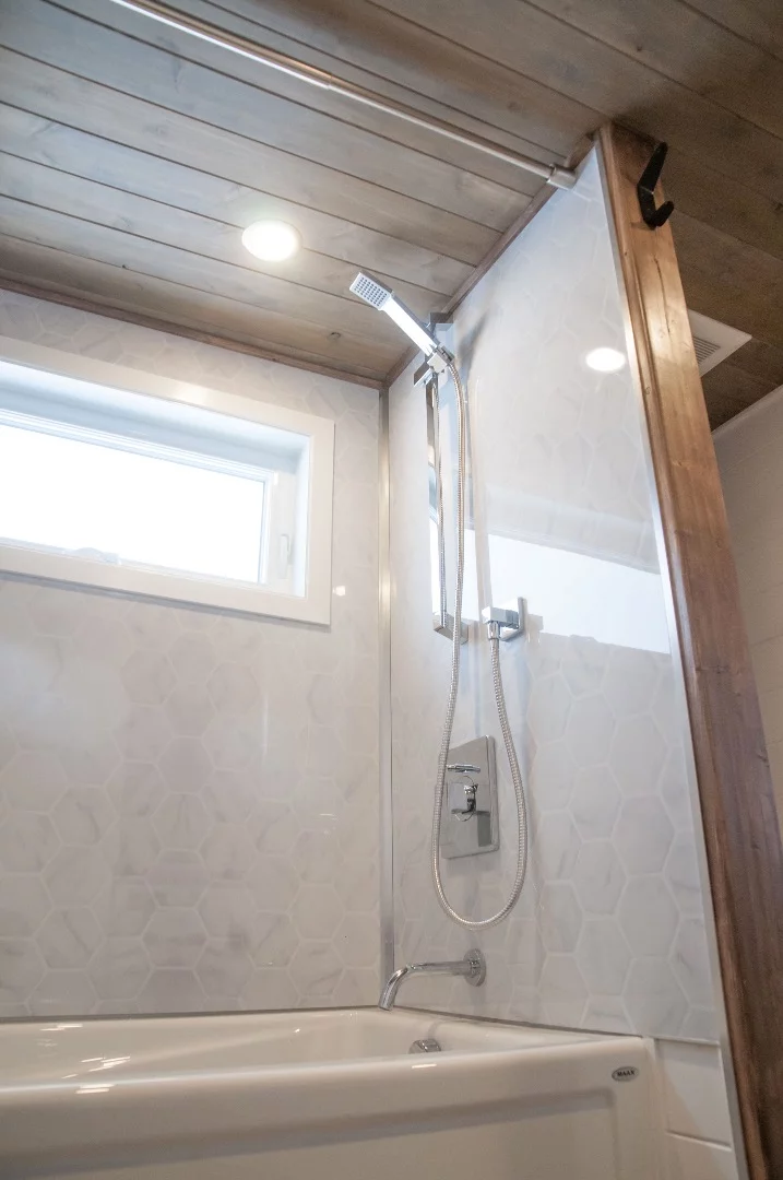 The Ébène's bathroom includes a bath/shower and composting toilet