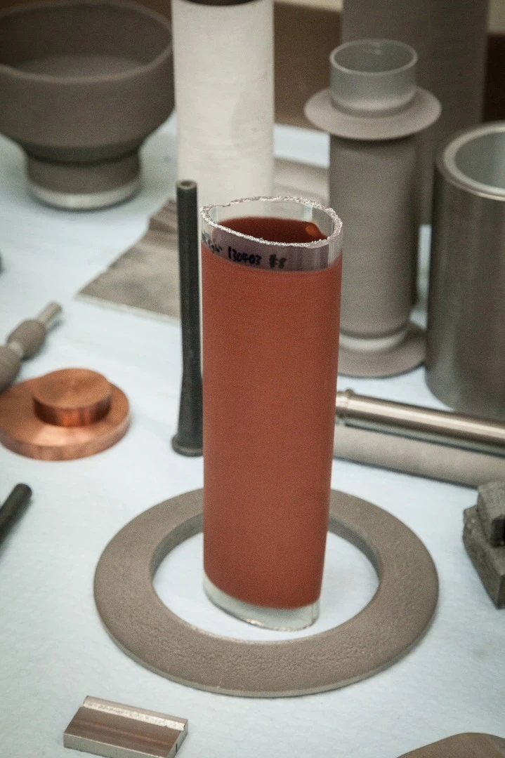 Cold spray technology has been used to put a metallic coating on the outside of this flexible plastic tube
