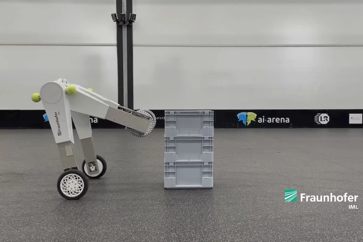 The evoBOT prepares to grasp and carry a plastic crate