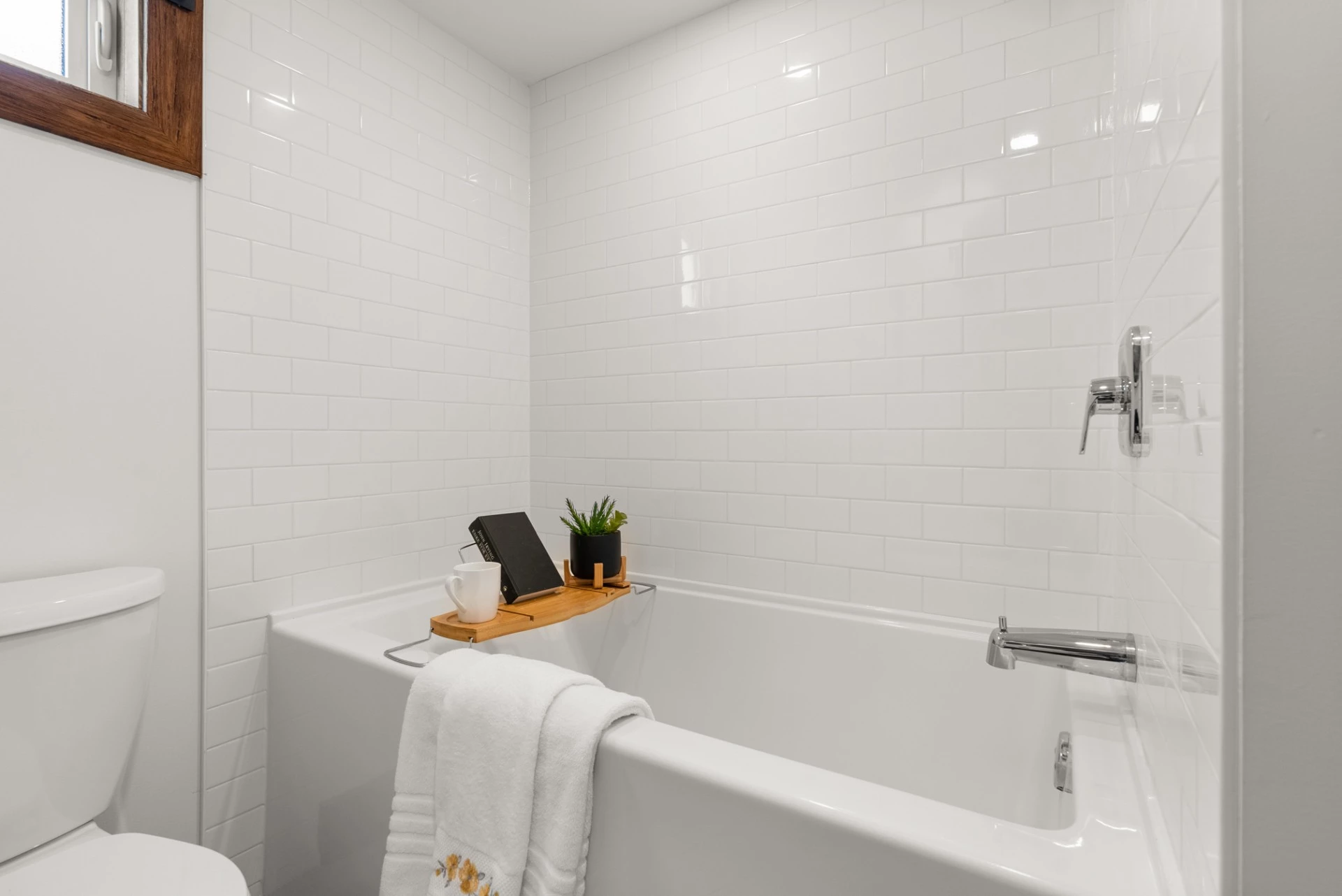 The Cypress' bathroom features a bathtub/shower, which is a rarity in a tiny house