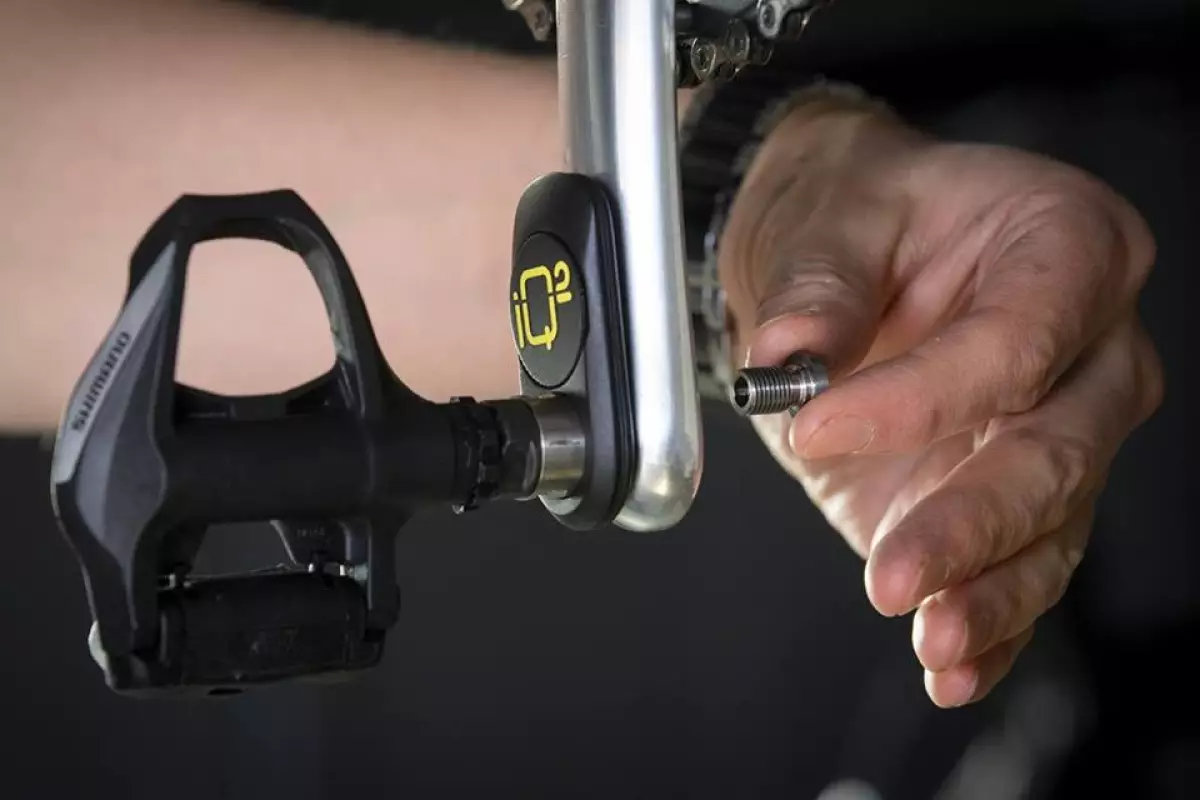 The IQ² is installed between the pedal and the crank