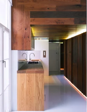 The architects created a large central structure that divided the space into three zones: living, sleeping and kitchen area