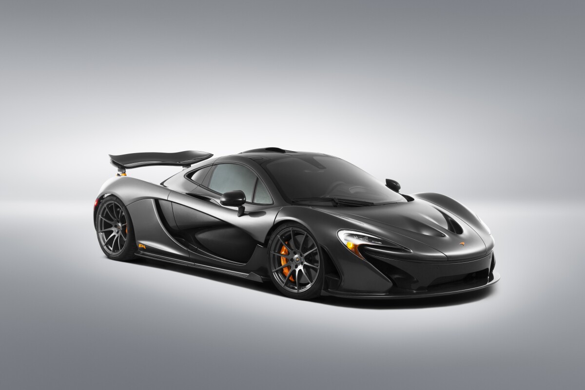 Orange brake calipers stand out from behind the P1's wheels