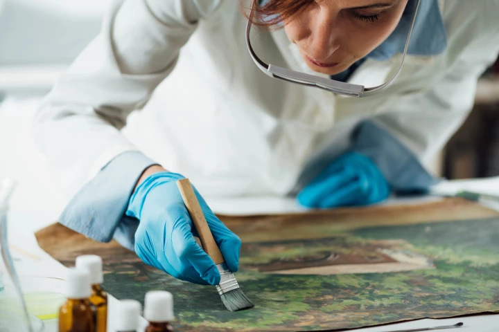 Traditional methods of restoring damaged artwork (pictured) can take up to several years per painting