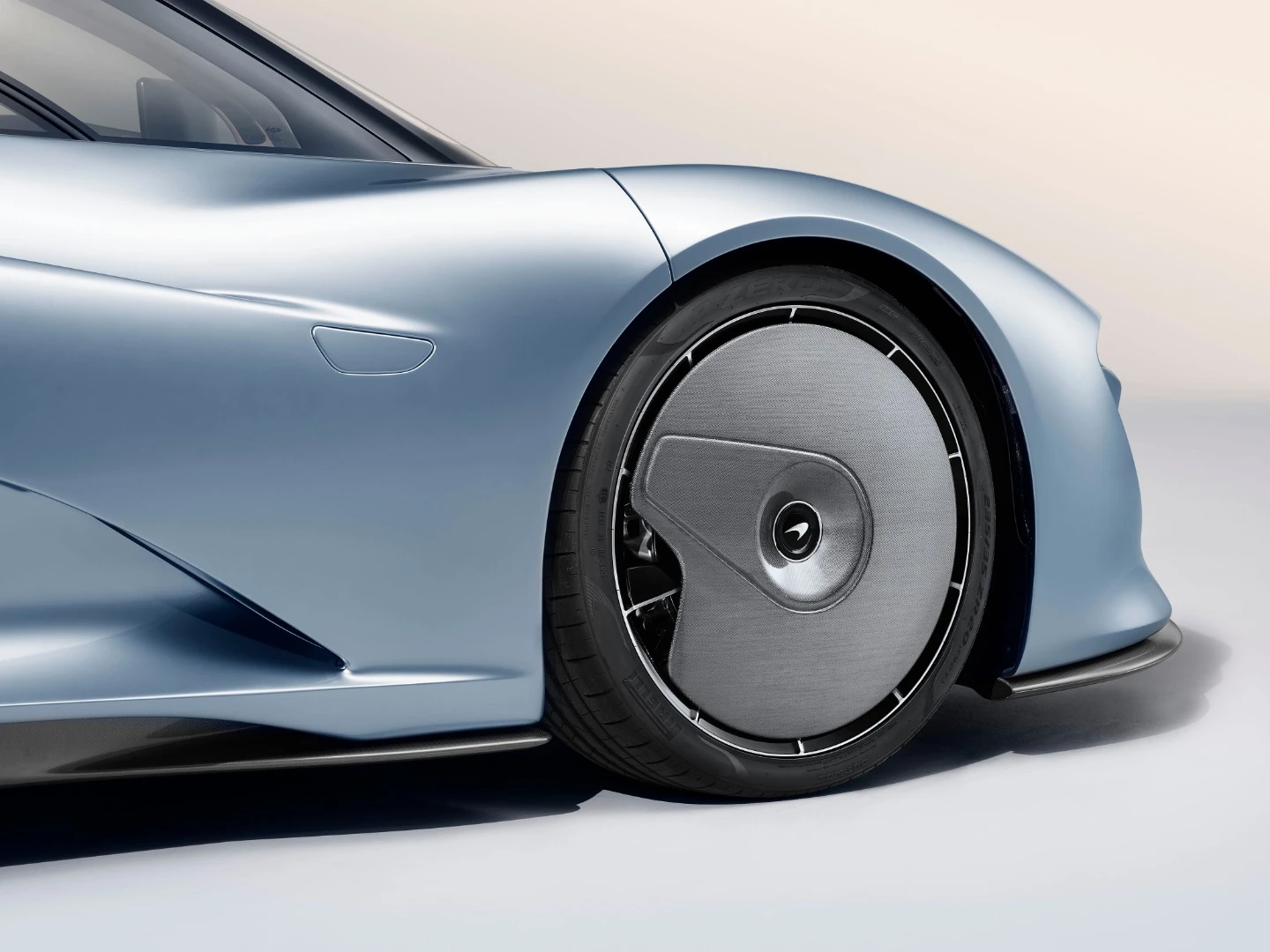 McLaren Speedtail: wheel covers stay still as the wheel rotates, reducing the tendency to push air outward from a spinning wheel