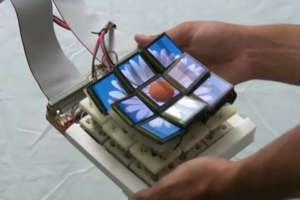 The Tilt Display prototype has nine screen components that move and tilt individually to physically represent what is on screen