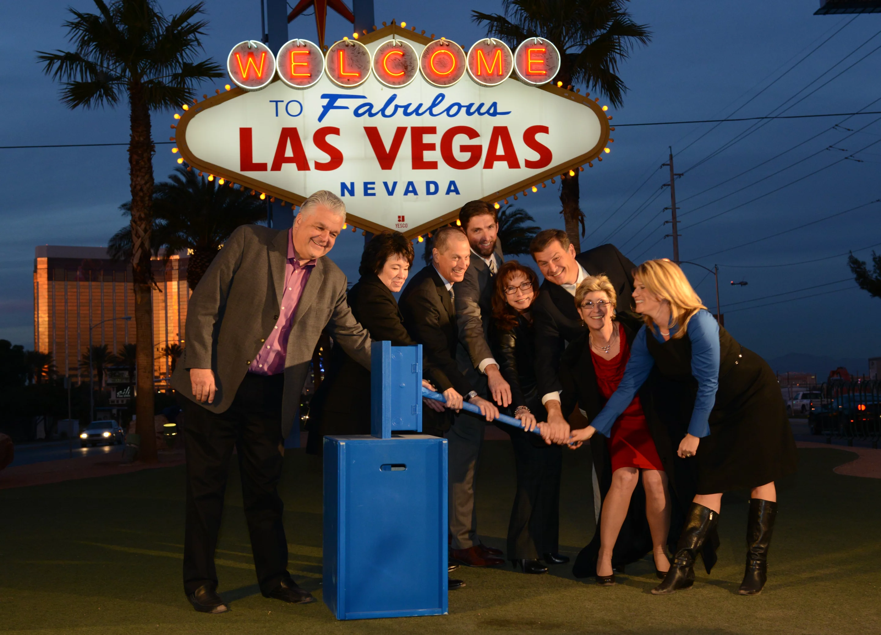 Local luminaries fire up the now solar-powered Las Vegas sign